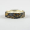 Gold Chaos - 6 mm. The ring is made from sterling silver, slightly textured with reticulation and oxidized. Gold spots are solid 18kt gold. It is random mix of gold dust, microgranules and solder fused to silver surface.