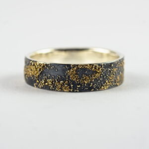 Gold Chaos - 6 mm. The ring is made from sterling silver, slightly textured with reticulation and oxidized. Gold spots are solid 18kt gold. It is random mix of gold dust, microgranules and solder fused to silver surface.