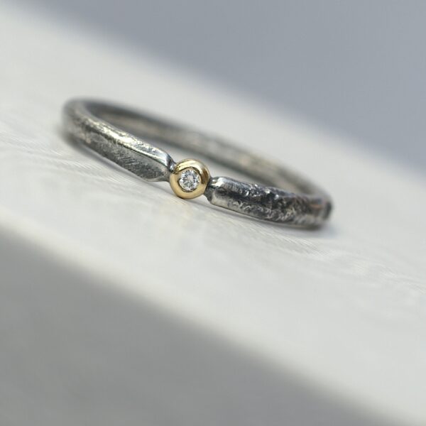 Rustic Diamond 18k Yellow Gold: Sterling silver band textured with reticulation (melting of the surface), round and comfortable, 2mm wide. Gemstone setting is made from 18k Yellow gold. Diamond is 1.5 mm, SI quality, near colorless (G/H) and conflict free. Set in neat gold ball.