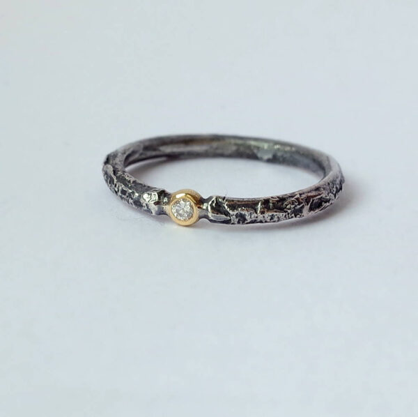 Rustic Diamond 18k Yellow Gold: Sterling silver band textured with reticulation (melting of the surface), round and comfortable, 2mm wide. Gemstone setting is made from 18k Yellow gold. Diamond is 1.5 mm, SI quality, near colorless (G/H) and conflict free. Set in neat gold ball.