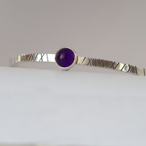 Amethyst Cuff Bracelet: Sterling silver textured bracelet with amethyst cabochon.