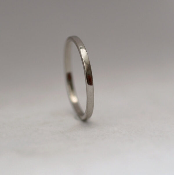 Dainty Palladium: The ring is made from flattened 1.5mm round wire, hand forged to flat shape with rounded edges. All hammer marks are then smoothened and ring is polished to shiny finish.