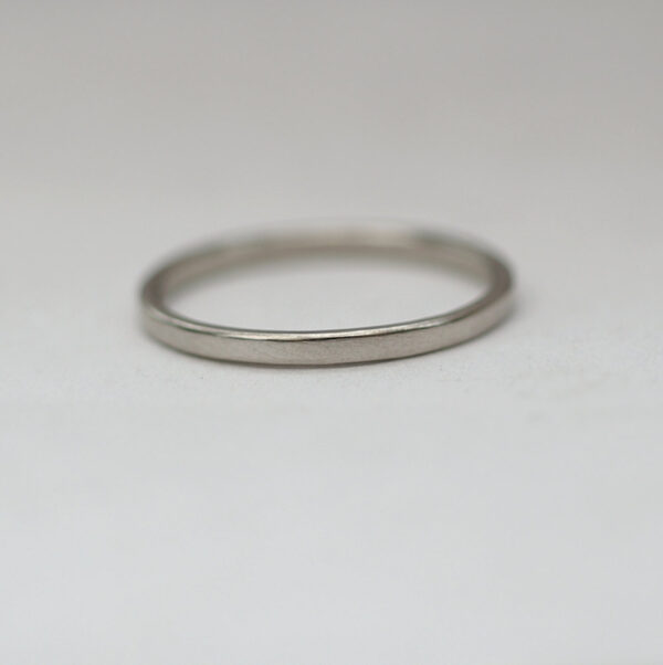 Dainty Palladium: The ring is made from flattened 1.5mm round wire, hand forged to flat shape with rounded edges. All hammer marks are then smoothened and ring is polished to shiny finish.