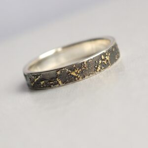 Gold Chaos - 4 mm. The ring is made from sterling silver, slightly textured with reticulation and oxidized. Gold spots are solid 18kt gold. It is random mix of gold dust, microgranules and solder fused to silver surface.