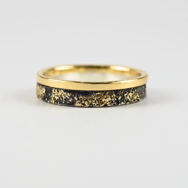 Gold Chaos with Gold Edge: The ring is made from sterling silver, slightly textured with reticulation and oxidized. Gold spots are solid 18kt gold. It is random mix of gold dust, microgranules and solder fused to silver surface. The edge is solid 18k gold.