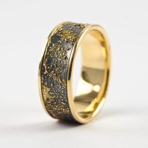 Gold Chaos Luxury: Distinctive and luxurious wedding band featuring contrast of rich yellow gold and oxidized silver.