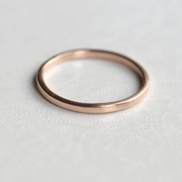 Dainty Rose Gold Wedding Band: Simple dainty rose gold wedding ring. Thin, lightweight and versatile, easy to combine with engagement ring.