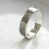 Rock Texture Ring: Unisex ring or men's band decorated with rock resembling hammered texture.
