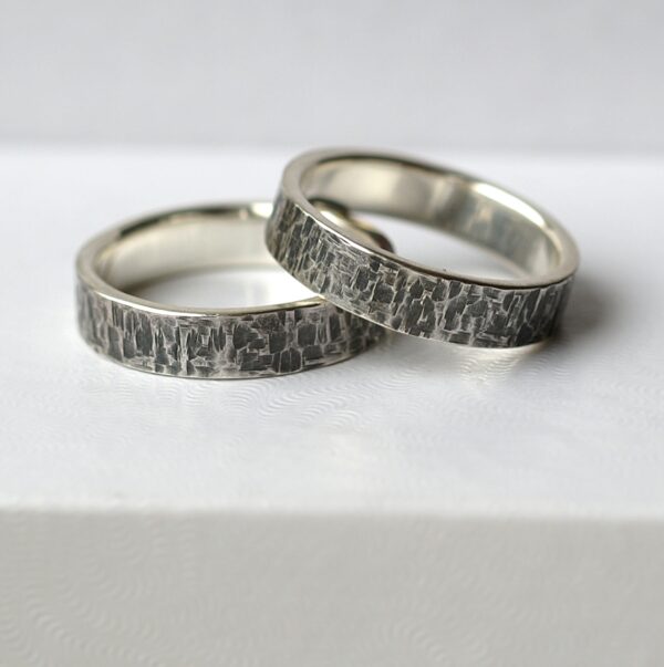 Rock Texture Rings Set: A set of sterling silver wedding bands with unique hammered texture.