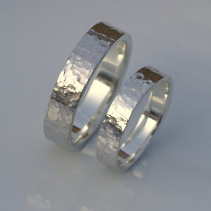 Rock Texture Rings Set: A set of sterling silver wedding bands with unique hammered texture.