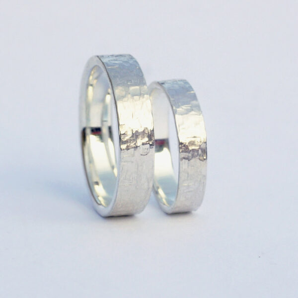 Rock Texture Rings Set: A set of sterling silver wedding bands with unique hammered texture.