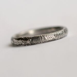 Rustic Oval Wedding band: This ring is made with oval shaped wire textured with reticulation technique. It is done with many rounds of high heat treatment resulting in melting of silver surface only.