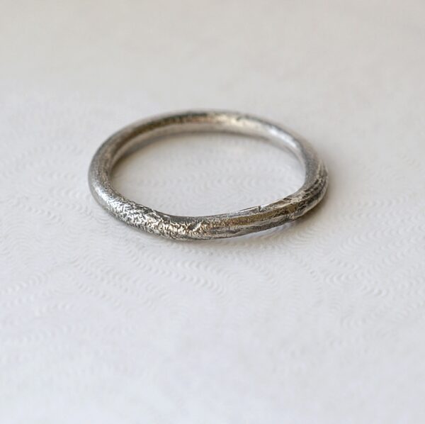 Rustic: Sterling silver band textured with reticulation (melting of the surface), round and comfortable, 2mm wide.