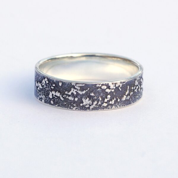 Silver Chaos - Oxidized Finish: Sterling silver wedding band with unique rustic texture. The texture is done by layering and fusing silver dust and micro pieces onto the heat treated surface of the ring.