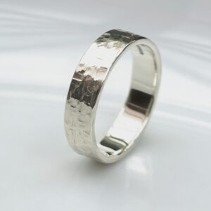 Rock Texture 9k White Gold Ring: Simple hammered wedding band made of 9k white gold.