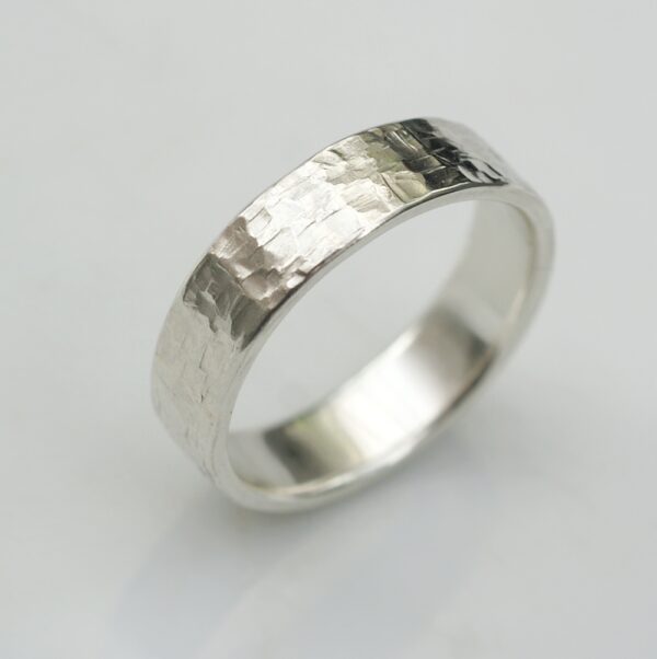 Rock Texture 9k White Gold Ring: Simple hammered wedding band made of 9k white gold.