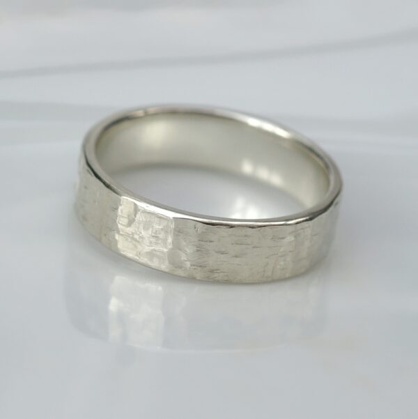 Rock Texture 9k White Gold Ring: Simple hammered wedding band made of 9k white gold.