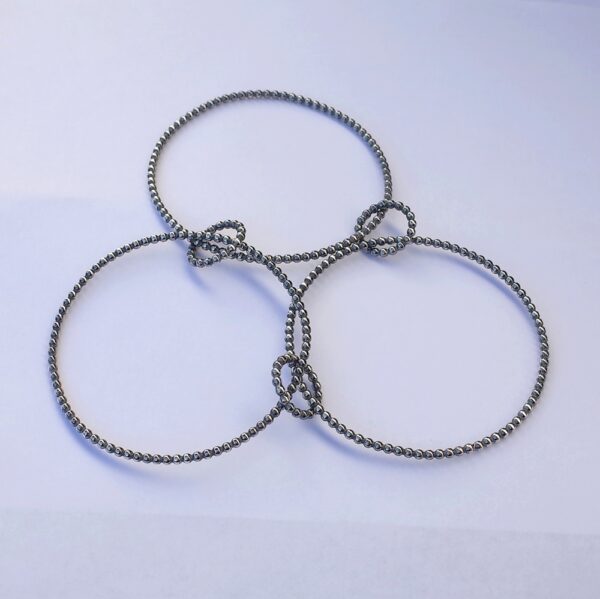 Interlocking Bangle Bracelet - made of three big circles and three small circles interlocked together in the way that they can be folded together to one bangle where all parts can spin and move.