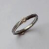 Rustic Diamond 3mm - sterling silver textured band with 3 mm diamond in 18k gold setting.