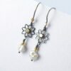 Black Daisies - romantic dainty flower earrings in oxidized sterling silver and 18k yellow gold with freshwater pearl.