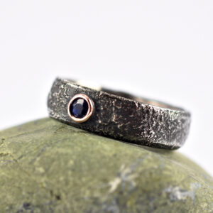 Black Sapphire Men's Engagement Ring - Rustic silver ring with black sapphire in a rose gold setting.