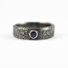 Black Sapphire Men's Engagement Ring - Rustic silver ring with black sapphire in a rose gold setting.