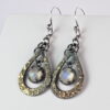 Oxidized sterling silver and 18k yellow gold moonstone earrings.