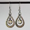 Oxidized sterling silver and 18k yellow gold moonstone earrings.